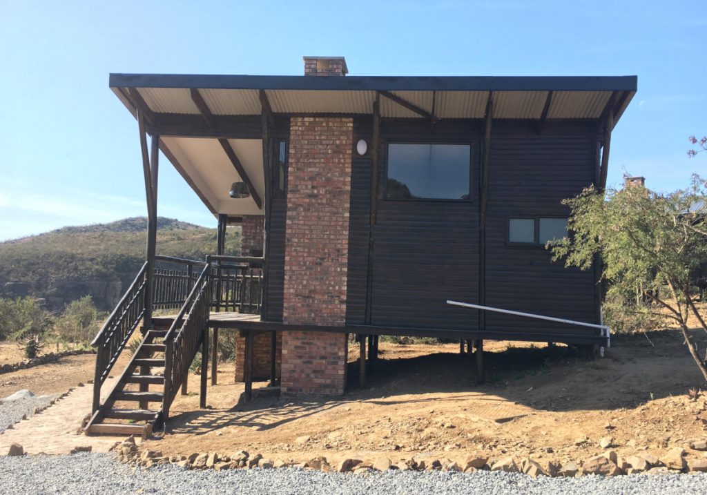 One bedroom cabin with steps to access, built by Bosazza Roofing & Timber Homes