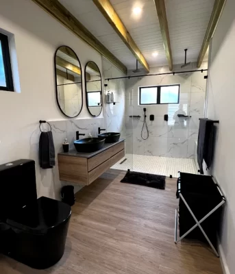 The en-suite has a double shower and premium fittings