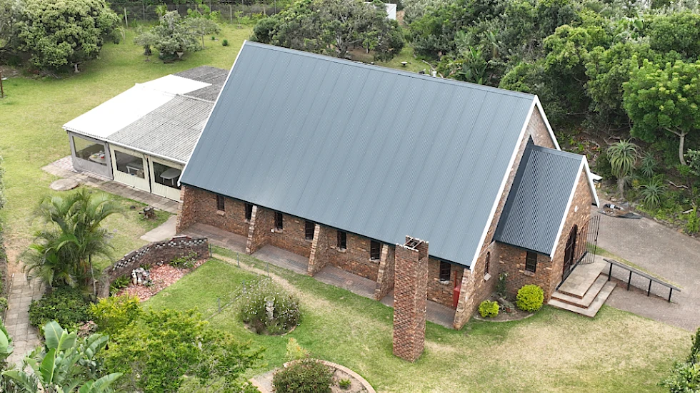 This roof has straight edges and angles which means that we could use Aluminum roof sheeting for the conversion