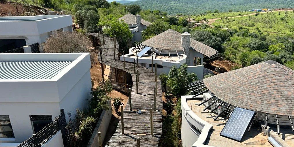 The circular roofs on this project are covered with shingle tiles